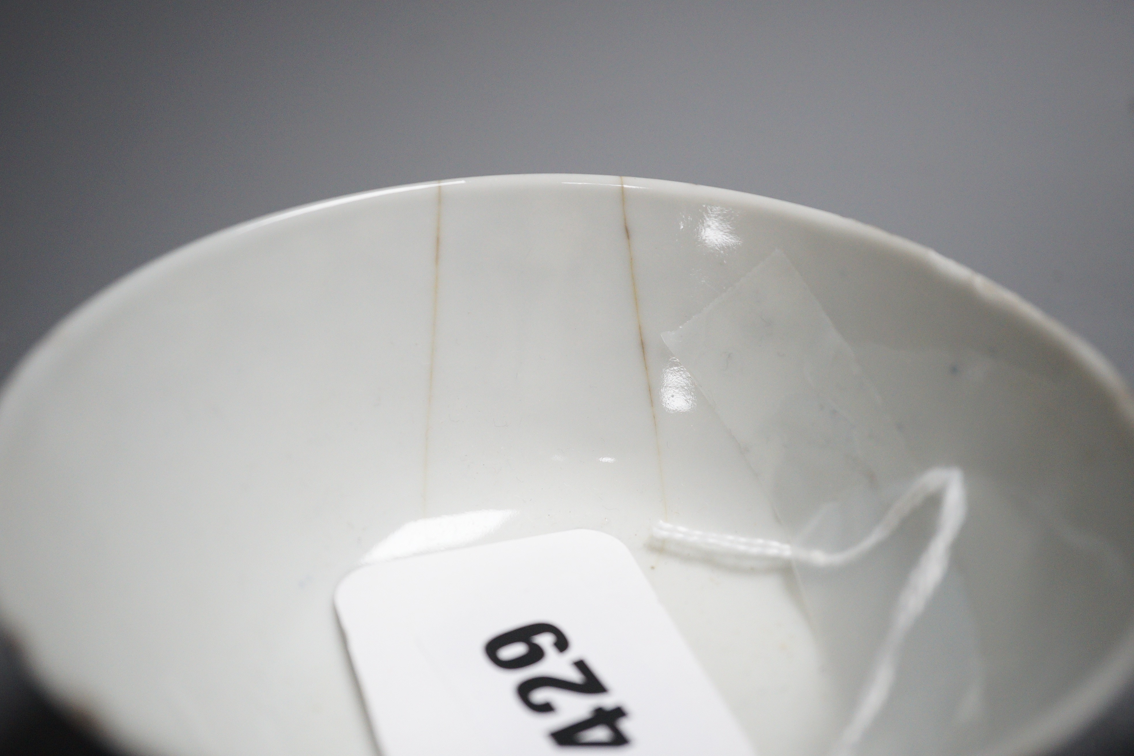 An early 20th century Chinese famille rose vase, a Chinese blue and white jar, lacking cover and a blue and white bowl